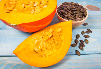 Pumpkins on rustic blue background. Autumn background.