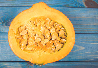 Pumpkins on rustic blue background. Autumn background.
