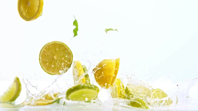 Fresh citruses dropped into water with splash, shooted with high speed cinema camera at 1000 fps. 4K footage.