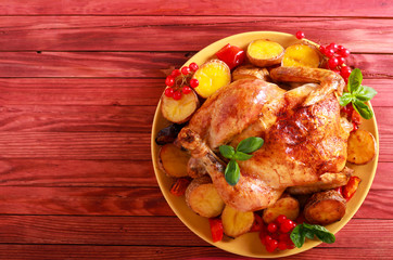 Baked chicken with vegetables on plate