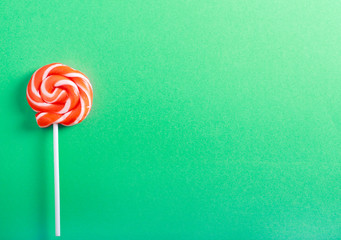 Orange and white swirl lollypop