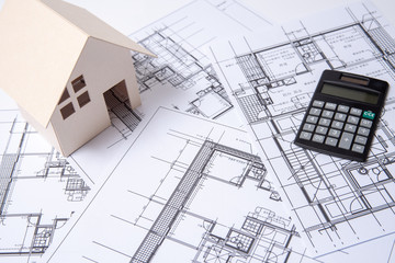 heap of design and project drawings on table background.