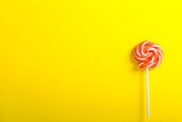 Orange and white swirl lollypop