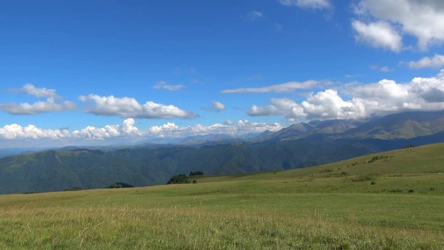 View mountains scenes in national park Dombai, Caucasus, Russia, Europe. Summer landscape, sunshine weather, blue sky and sunny day