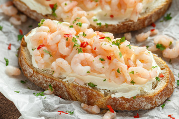 Prawns, shrimp seafood bruschetta with creamy cheese, parsley and chili