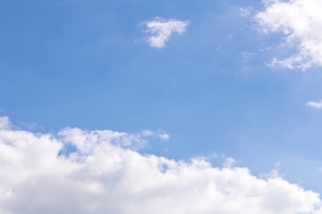 White fluffy clouds against a blue sky