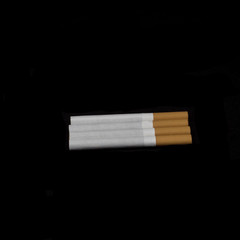 cigarettes isolated in black background 