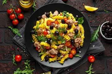 Pasta Tuna salad with tomatoes, wild rocket, black olives and red onion