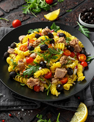 Pasta Tuna salad with tomatoes, wild rocket, black olives and red onion