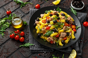Pasta Tuna salad with tomatoes, wild rocket, black olives and red onion