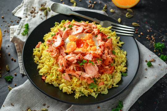 Traditional Indian-English kedgeree breakfast: basmati rice with egg benedict and hot smoked sweet chilli salmon.
