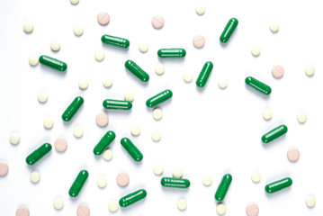 Medicine green and yellow pills or capsules