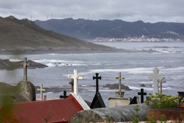 Fototapeta na wymiar cemetery near beach of crystals (praia dos cristais) in laxe in galicia,spain