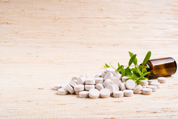 Obraz na płótnie Canvas Medicine herb. Herbal pills
