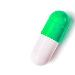 Medicine green and yellow pills or capsules