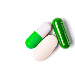Medicine green and yellow pills or capsules
