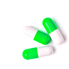 Medicine green and yellow pills or capsules
