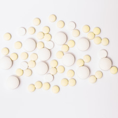 Medicine white and yellow pills or capsules