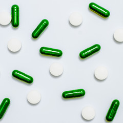 Medicine green and yellow pills or capsules