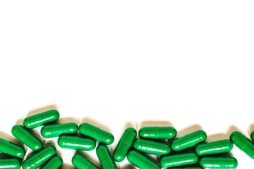 Medicine green pills or capsules with copy space