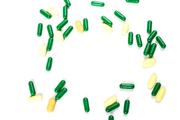 Medicine green and yellow pills or capsules