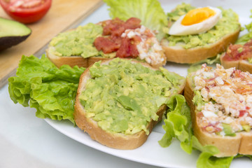 sandwiches with avocado, tomato and egg, tasty healthy Breakfast, bread