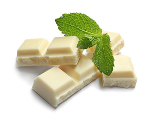 Pieces of white chocolate with mint on white background