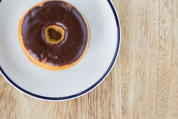 Colorful donuts on dish