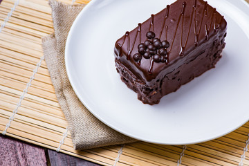 Chocolate cake on white plate