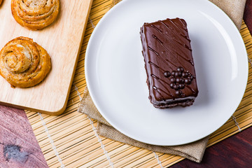 Chocolate cake on white plate