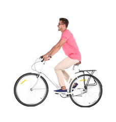 Handsome young hipster man riding bicycle on white background
