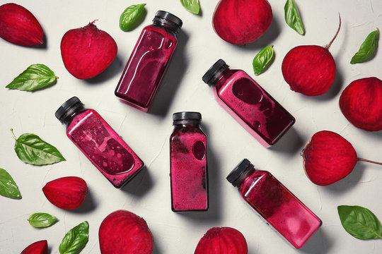 Flat lay composition with beet smoothies on light background