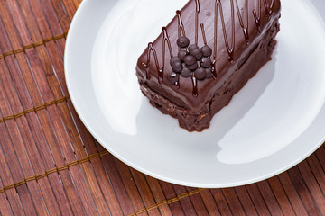 Chocolate cake on white plate