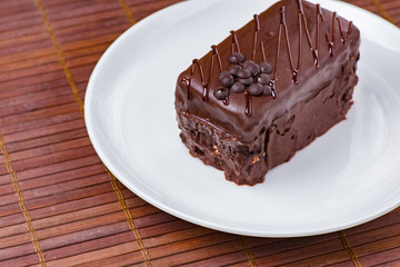 Chocolate cake on white plate