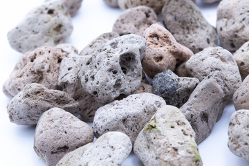 A natural piece of pumice stone isolated on white background.