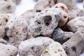 A natural piece of pumice stone isolated on white background.