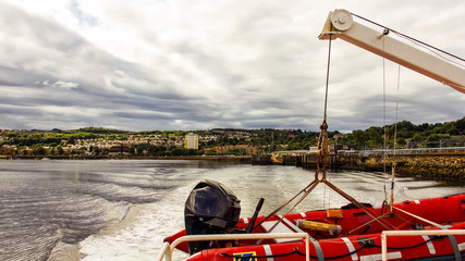 View from the rear of a passenger ferry leaving the pier at Gourock.