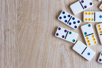Domino tiles on wooden background
