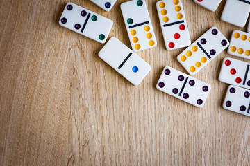 Domino tiles on wooden background