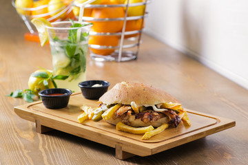 Delicious doner kebab on wooden background