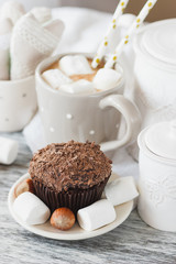 Chocolate cupcakes, marshmallow and different Christmas decorations
