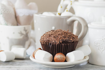 Chocolate cupcakes, marshmallow and different Christmas decorations