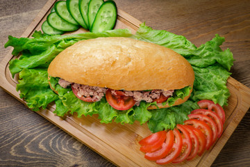 Tuna sandwich on wooden background