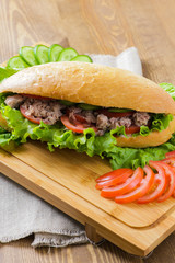 Tuna sandwich on wooden background