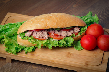 Tuna sandwich on wooden background