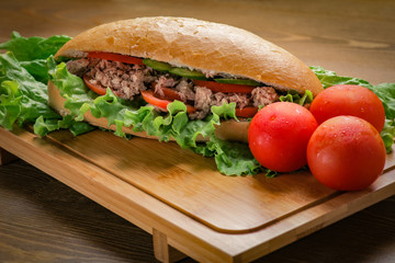 Tuna sandwich on wooden background