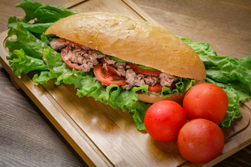 Tuna sandwich on wooden background