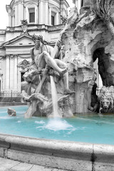 Black and white photo with color splash effect of the Fountain of the Four Rivers in the Piazza Navona (Navona Square) in Rome was designed in 1651 by Gian Lorenzo Bernini. Italy