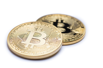 Golden bitcoin isolated on white