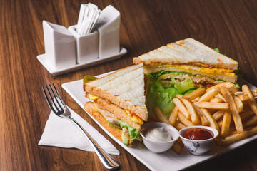 Club sandwich served with french fries